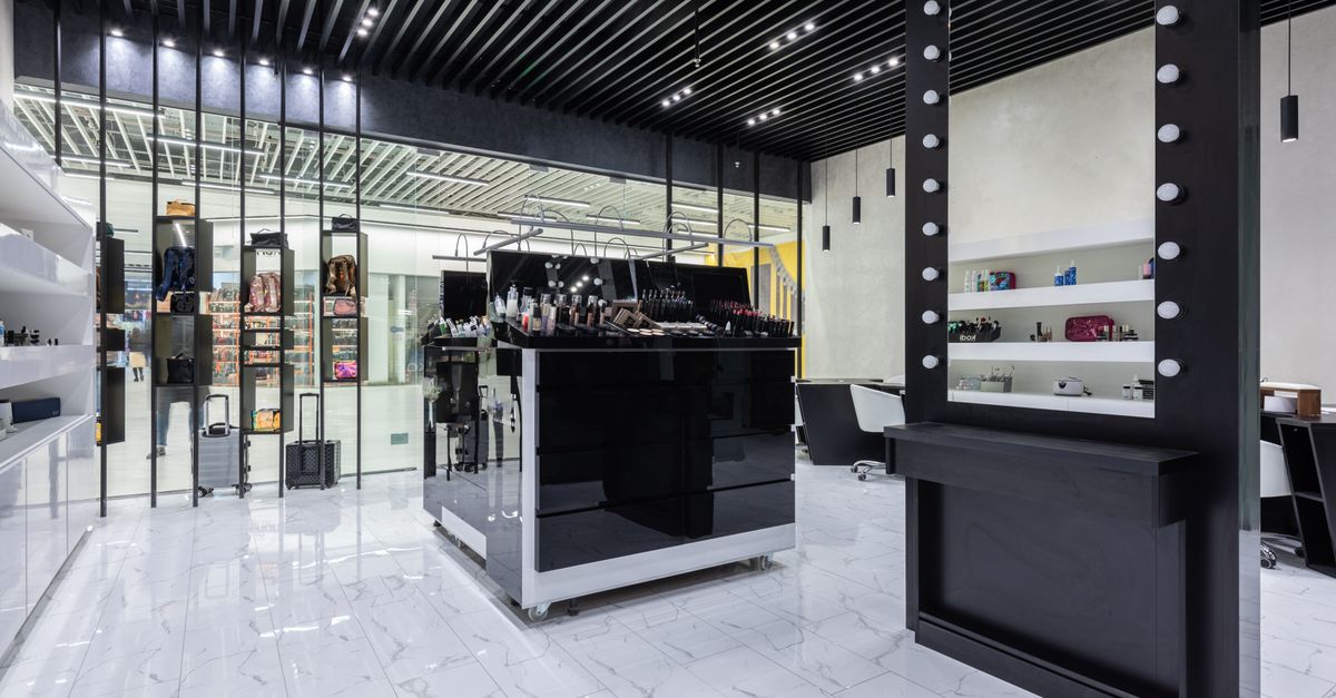 Retail showroom with polished white marble tile flooring